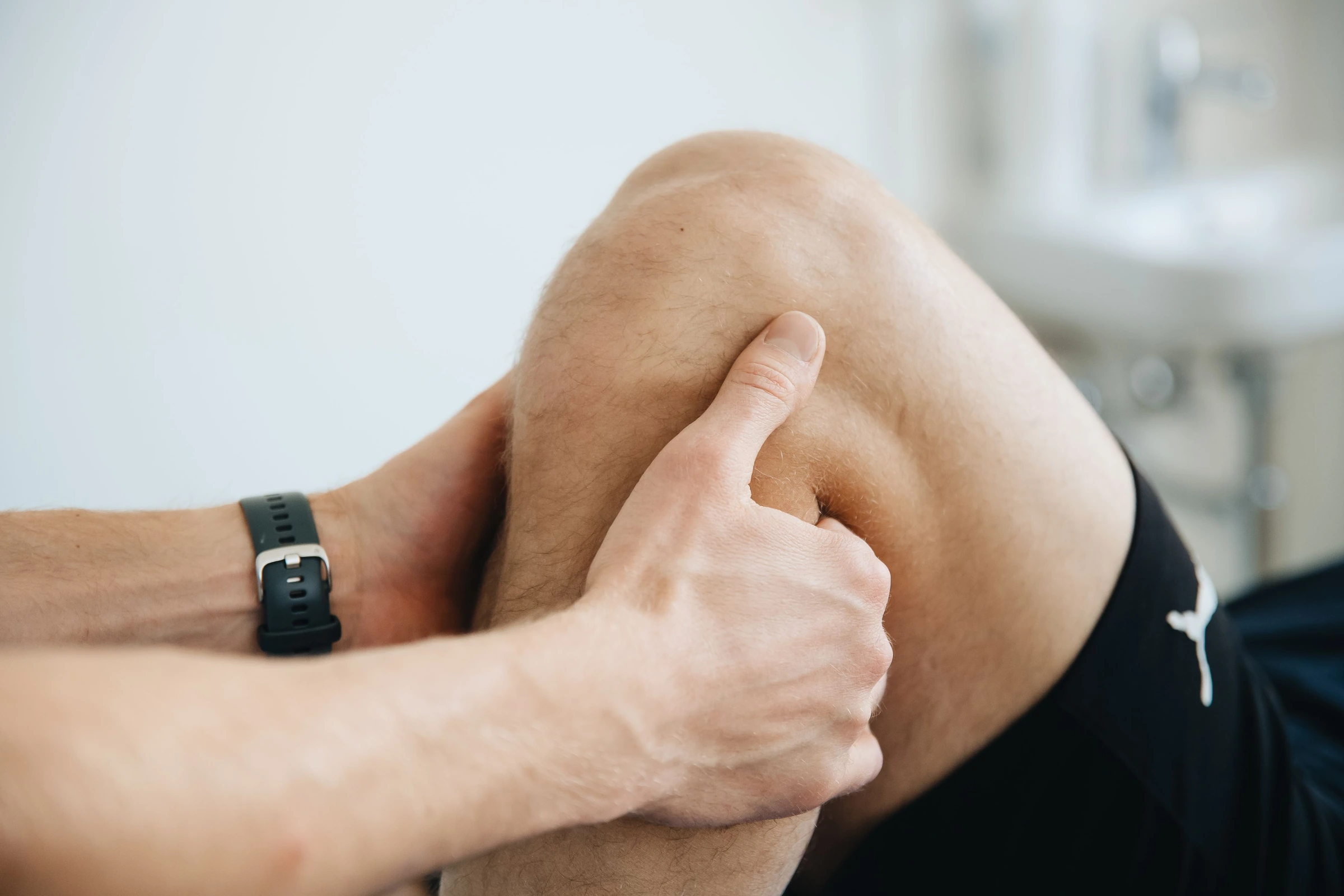 Physiotherapist evaluating a knee