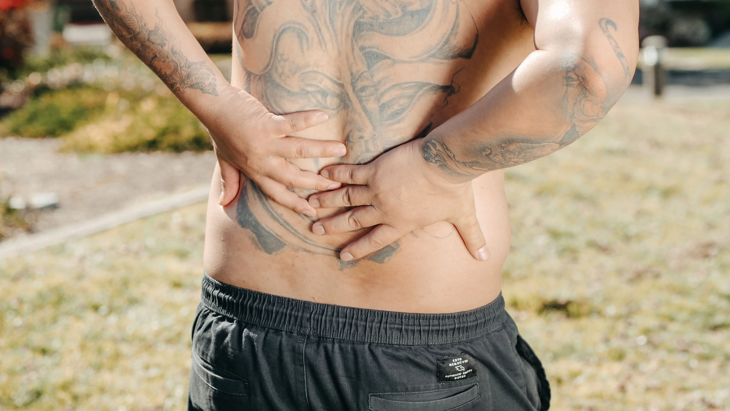 Adult holding the lower back